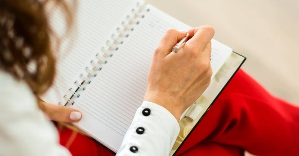 Teaching Write to Meet the Needs of Your Students teacher holding a notebook