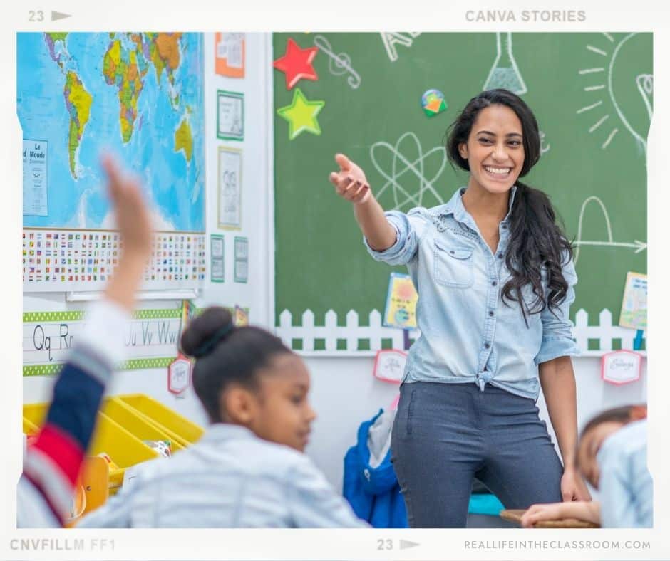 A teacher refers to the sound wall as she is teaching her students