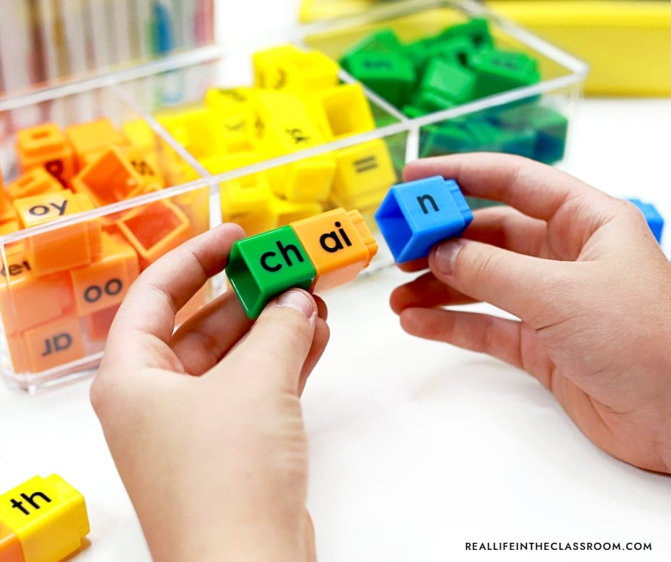 Hands on phonics literacy center for building words using grapheme cubes