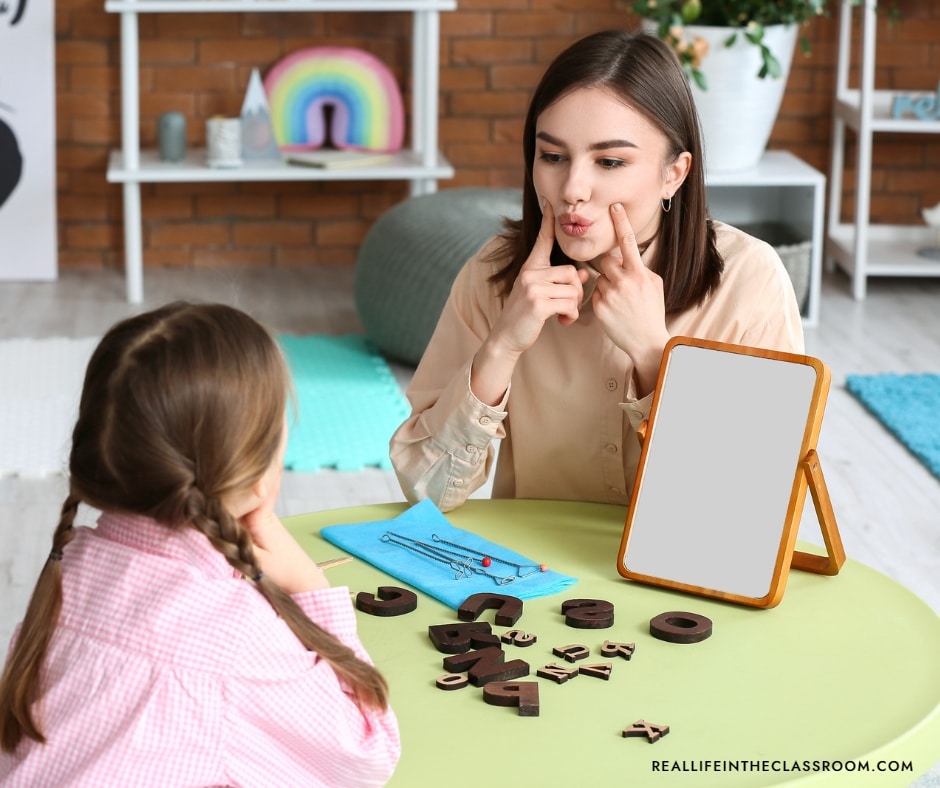 Teacher working with student on articulatory gestures