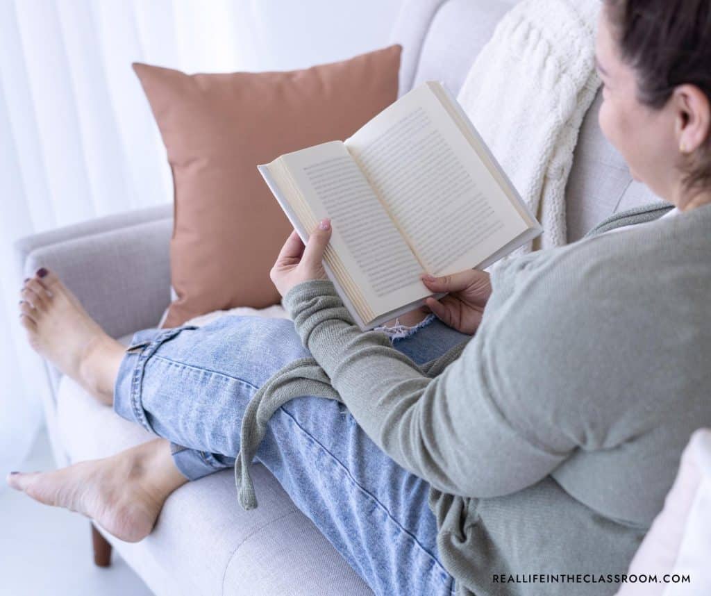 a teacher reading a book
