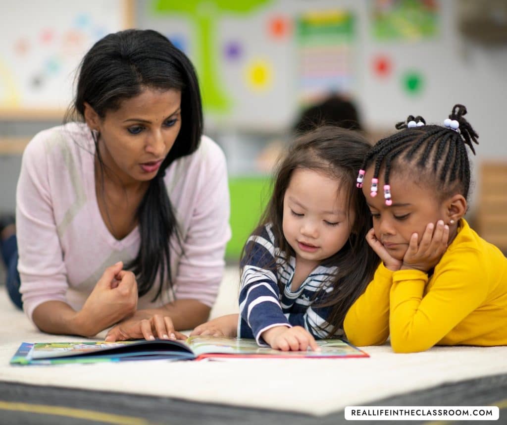 A teacher reader with two young students