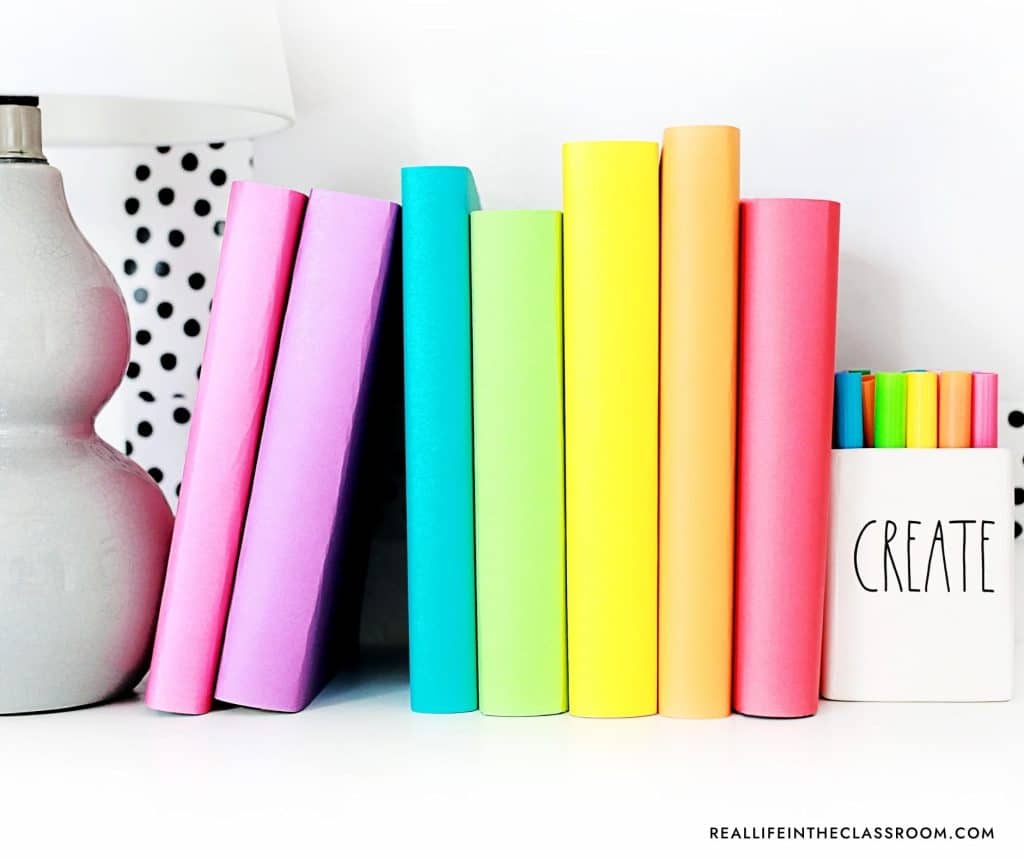 a set of books on a teachers desk