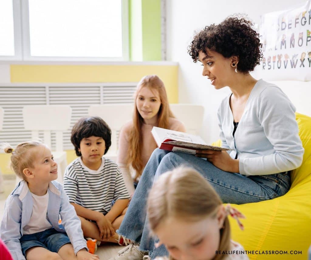 a teacher reading to a group of students