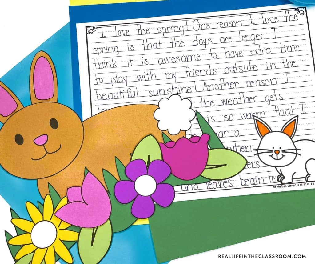 a bunny craft to accompany a spring writing piece on a bulletin board for the classroom